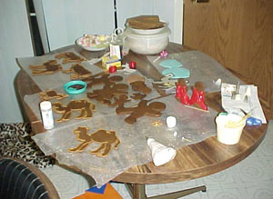 Our first try for the animals was to outline them in icing. This table was the "icing" table where we did the work. We also found that fruit rollups make great wise men robes (see the men in red).