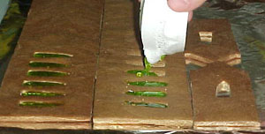 Then we poured the hot "glass" into the window holes.