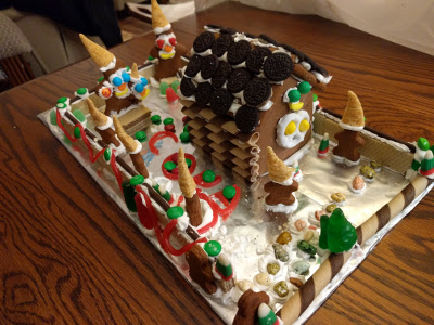 Cora's second house. We had fun with the bugels this year - don't they look like elf hats on the tiny gingerbread men?